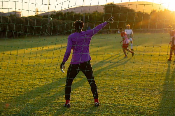 Rear View African American Goalkeeper Hand Raised Pointing While Standing — Stock Photo, Image