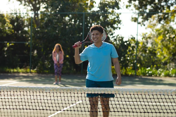Smiling Biracial Couple Playing Tennis Sunny Outdoor Tennis Court Inclusivity — Stock Photo, Image