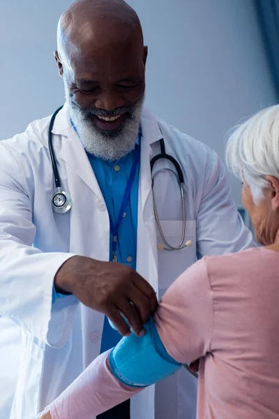 Vertical Happy Diverse Senior Male Doctor Taking Blood Pressure Female — Photo