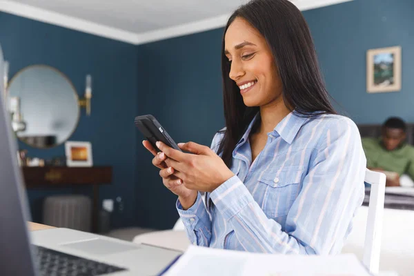 Happy Biracial Woman Using Laptop Smartphone Smiling Bedroom Partner Background — Stock Photo, Image