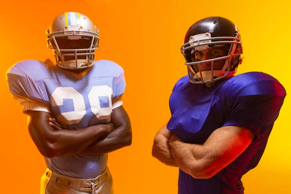 Diverse Male American Football Players Wearing Helmets Neon Orange Lighting — Stock Photo, Image