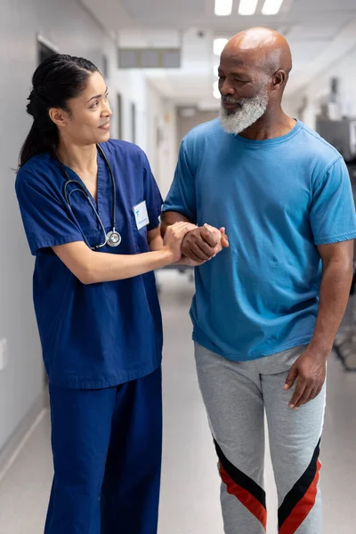 Vertical Happy Diverse Female Doctor Helping Senior Male Patient Walk — Photo