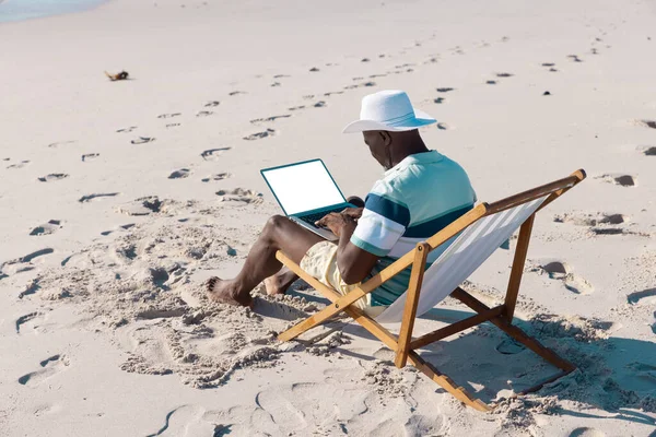 African American Senior Man Wearing Hat Working Laptop While Relaxing — Stock Photo, Image