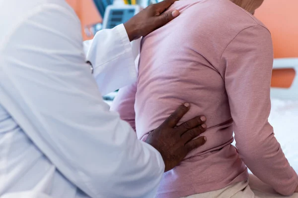 Midsection Diverse Senior Male Doctor Examining Back Senior Female Patient — Stock fotografie