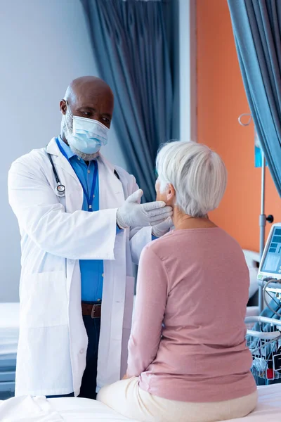 Vertical Diverse Senior Male Doctor Examining Throat Senior Female Patient — Photo