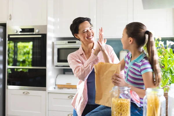 Caucasian Mother Daughter Unpacking Shopping Bag Together Modern Kitchen Spending — Stock Photo, Image