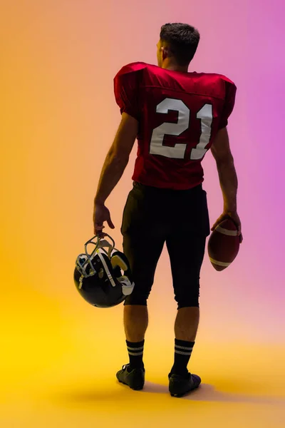 Caucasian Male American Football Player Holding Helmet Ball Neon Yellow — Stock Photo, Image