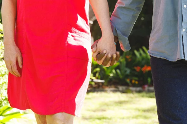 Happy Senior Diverse Couple Holding Hands Garden Spending Quality Time — Stock Photo, Image