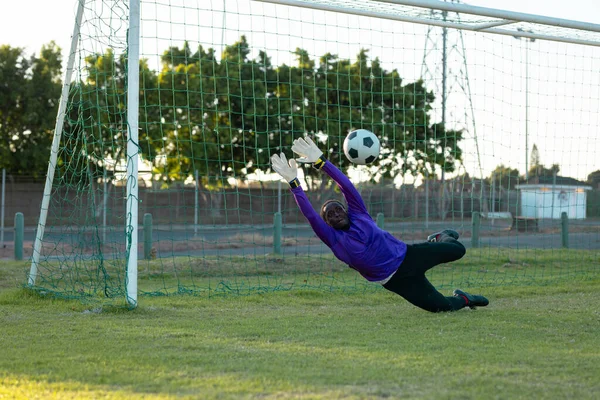 African American Male Goalkeeper Arms Raised Catching Soccer Ball Mid — Stock Photo, Image