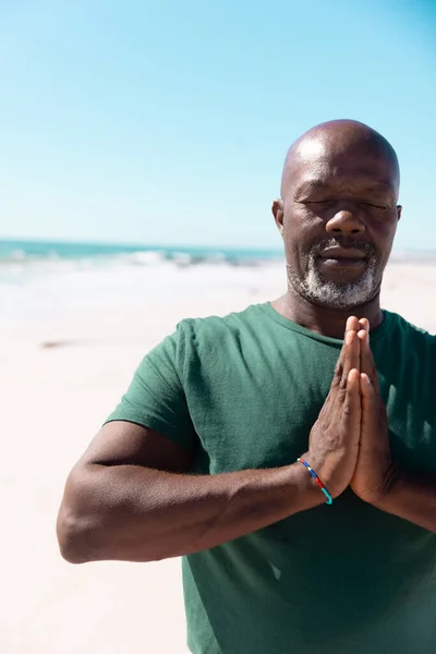 African American Bald Senior Man Eyes Closed Meditating Beach Clear — Stock Photo, Image