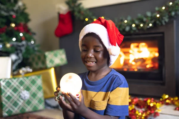 Happy African American Boy Holding Christmas Snowing Ball Siting Next — Stock Photo, Image