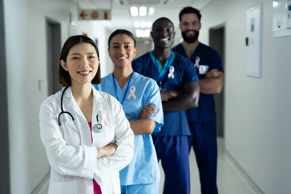 Portrait Diverse Group Smiling Healthcare Workers Wearing Cancer Ribbons Standing — Stock Photo, Image