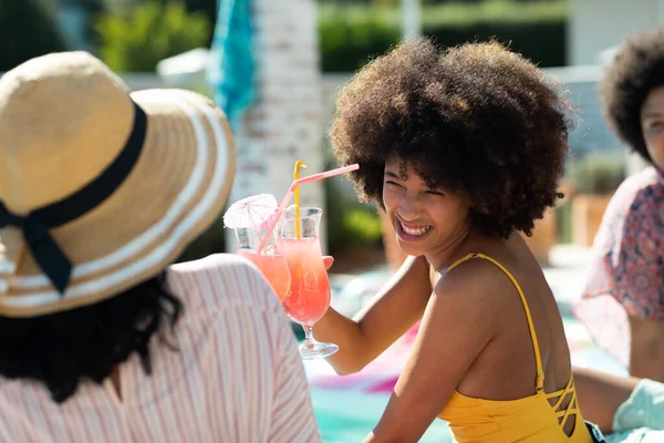 Smiling Biracial Young Woman Afro Hair Toasting Cocktail Friend While — Stock Photo, Image