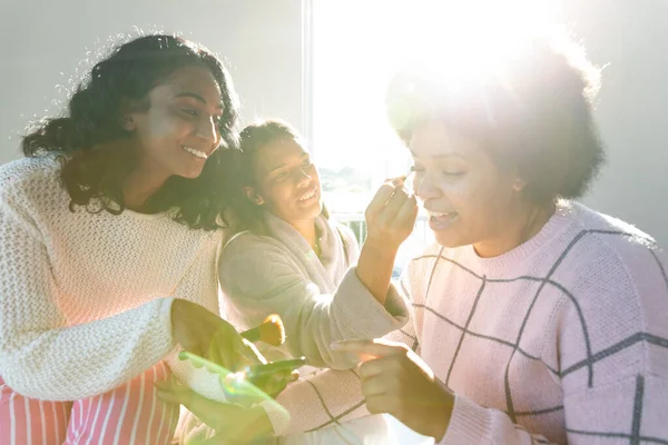 Biracial Happy Friends Applying Make Showing Cellphone Young Woman Window — Stock Photo, Image