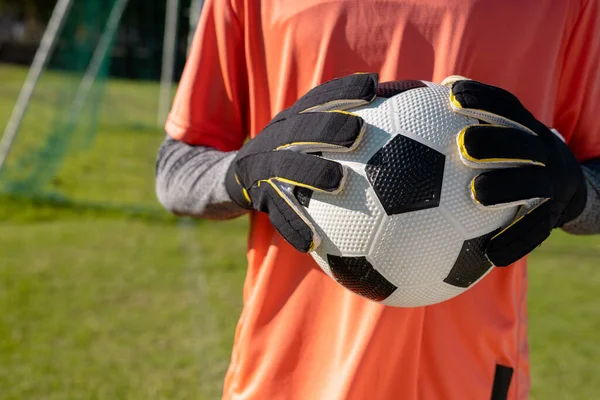 Midsection African American Male Goalkeeper Wearing Gloves Holding Soccer Ball — Stock Photo, Image