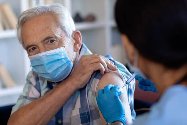 Biracial Female Health Worker Giving Injection Caucasian Senior Man Home — Stock Photo, Image