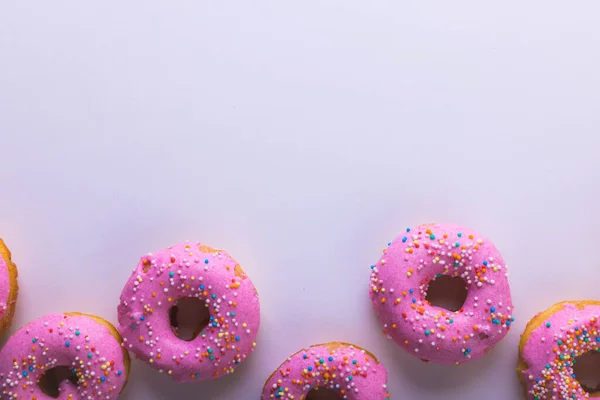 Overhead View Fresh Pink Donuts Sprinklers Copy Space White Background — Stockfoto