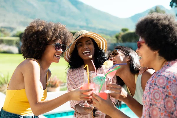 Cheerful Young Biracial Female Friends Toasting Cocktails While Having Fun — Stock Photo, Image