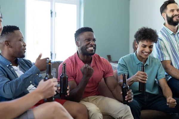 Cheerful Multiracial Man Gesturing Victory While Enjoying Match Male Friends — Stock Photo, Image