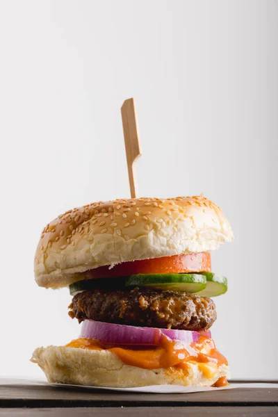 Close-up of fresh burger against white background, copy space. unaltered, food, studio shot and unhealthy food concept,