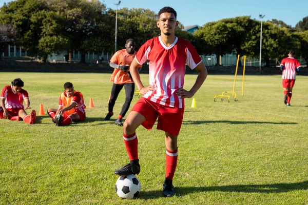 Multiracial Confident Male Player Uniform Arms Akimbo Leg Soccer Ball — Stock Photo, Image
