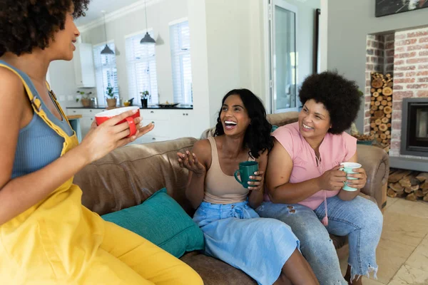 Biracial Young Woman Talking Cheerful Female Friends Laughing While Sitting — Stock Photo, Image
