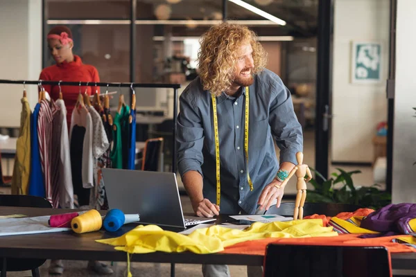 Smiling Young Caucasian Fashion Designer Looking Away While Working Desk — Stock Photo, Image