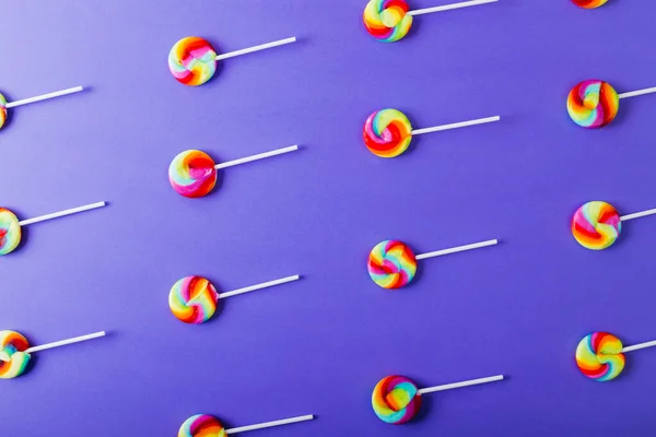 Overhead View Multi Colored Lollipops Arranged Side Side Blue Background — Stock Photo, Image