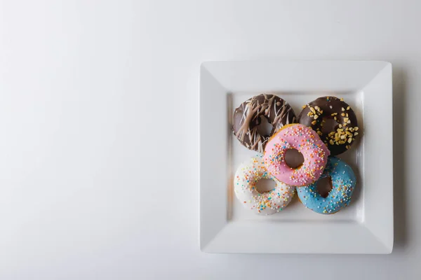 Directly View Fresh Multi Colored Donuts Square Plate Copy Space — Stock Photo, Image