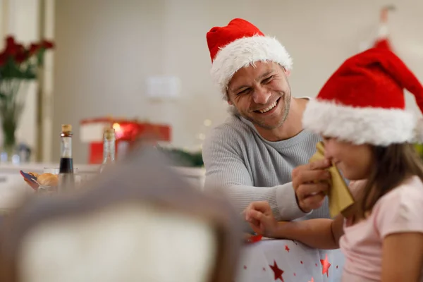Caucasian Man Sitting Table Smiling Wearing Santa Hat Quality Family — Stock Photo, Image
