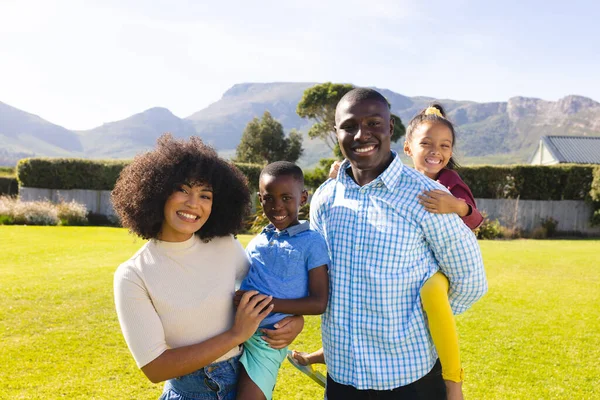 Portrait Happy Multiracial Mother Father Carrying Children While Standing Sky — Stock Photo, Image