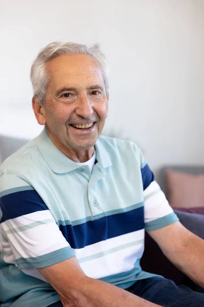 Portrait Smiling Caucasian Senior Man Sitting Sofa White Wall Living — Stock Photo, Image