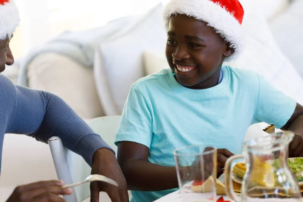 Multi Generation African American Family Dining Room Wearing Santa Hats — Stock Photo, Image