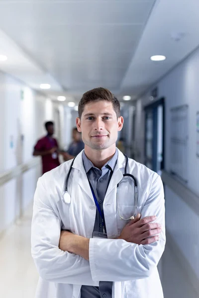 Unaltered Portrait Caucasian Male Doctor Smiling Hospital Corridor Copy Space — Stock Photo, Image
