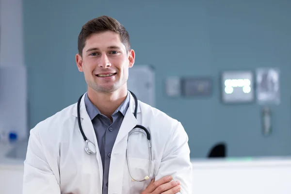 Unaltered Portrait Caucasian Male Doctor Arms Crossed Smiling Hospital Copy — Stock Photo, Image