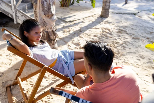 High Angle View Young Couple Talking While Sitting Deck Chairs — Stock Photo, Image