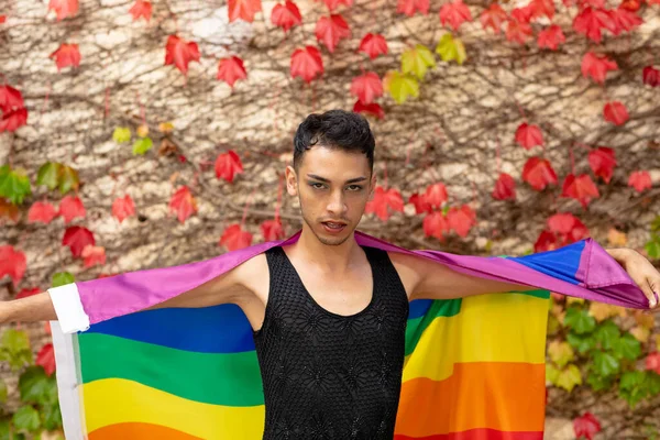 Portrait Biracial Transgender Man Holding Rainbow Flag Rocks Leaves Background — Stock Photo, Image