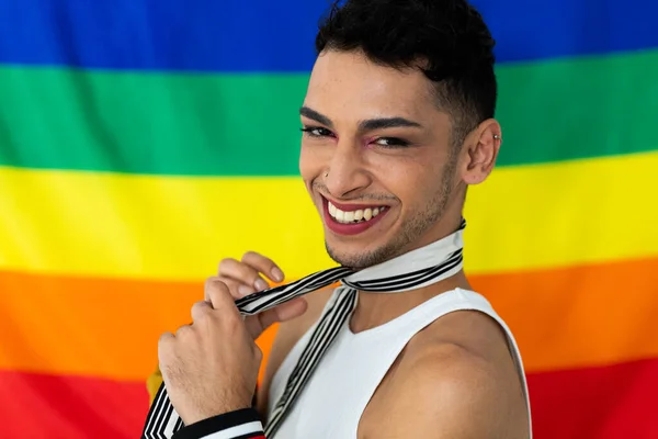 Portrait Happy Biracial Transgender Man Looking Camera Rainbow Flag Background — Stock Photo, Image