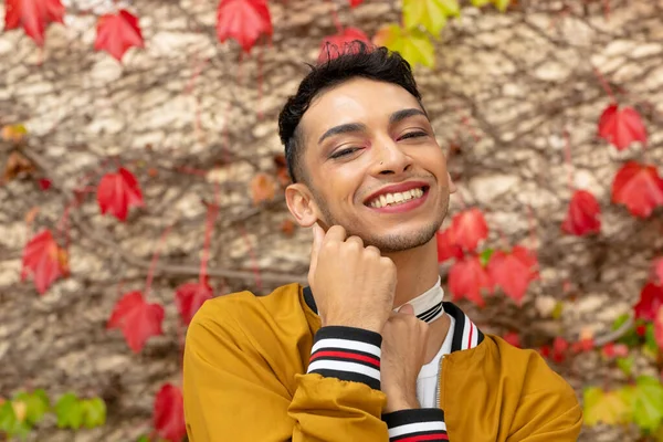 Portrait Happy Biracial Transgender Man Looking Camera Rocks Leaves Background — Stock Photo, Image