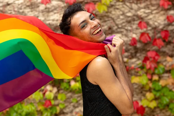 Portrait Happy Biracial Transgender Man Holding Rainbow Flag Rocks Leaves — Stock Photo, Image