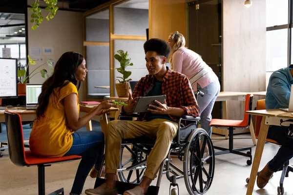 Diverse Female Male Colleague Wheelchair Discussion Using Tablet Desk Casual — Stock Photo, Image