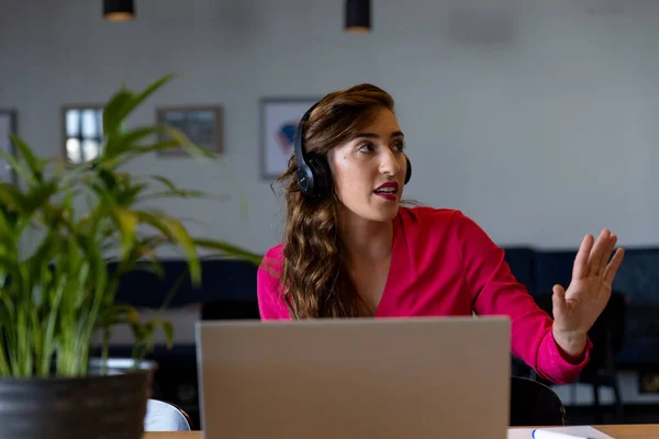 Caucasian Casual Businesswoman Making Video Call Using Headphones Laptop Desk — Stock Photo, Image