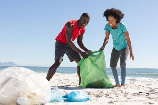 Happy African American Couple Cleaning Sunny Beach Collecting Litter Summer — Stock Photo, Image