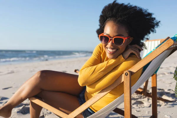 Portrait Happy African American Woman Sitting Deckchair Smiling Sunny Beach — Stock Photo, Image