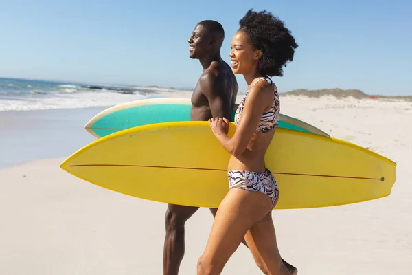 Happy Fit African American Couple Carrying Surfboards Walking Sunny Beach — Stock Photo, Image