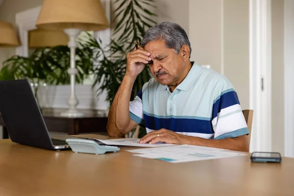 Senior Biracial Man Doing Paperwork Using Laptop Dining Room Finance — Stock Photo, Image
