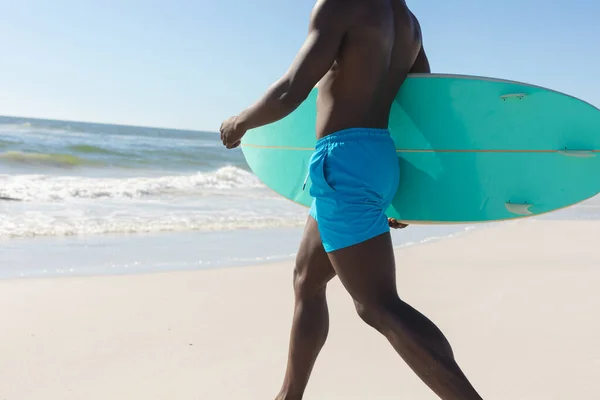 Midsection Fit African American Man Carrying Surfboard Walking Sunny Beach — Stock Photo, Image