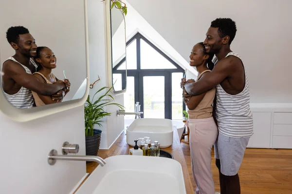 Happy African American Couple Brushing Teeth Hugging Bathroom Lifestyle Relationship — Stock Photo, Image