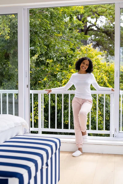 Happy Biracial Woman Slippers Relaxing Balcony Bedroom Treetops Background Wellbeing — Stock Photo, Image
