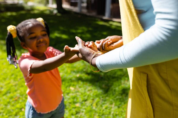 Midsection African American Mother Holding Daughter Hands Backyard Sunny Day — Stock Photo, Image